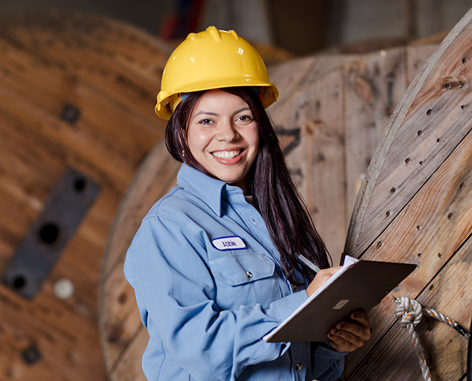 Storekeeper with a hardhat and clip board. 