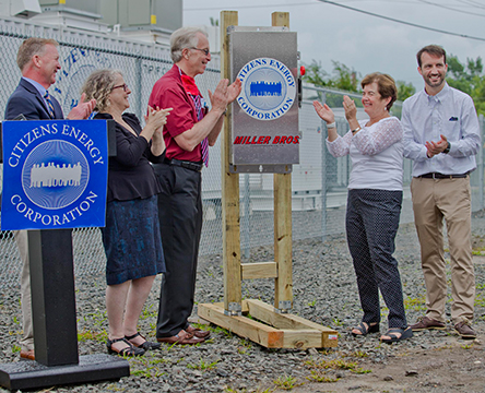 A group of special guests flipping the switch on the Marty Dunn Energy Center